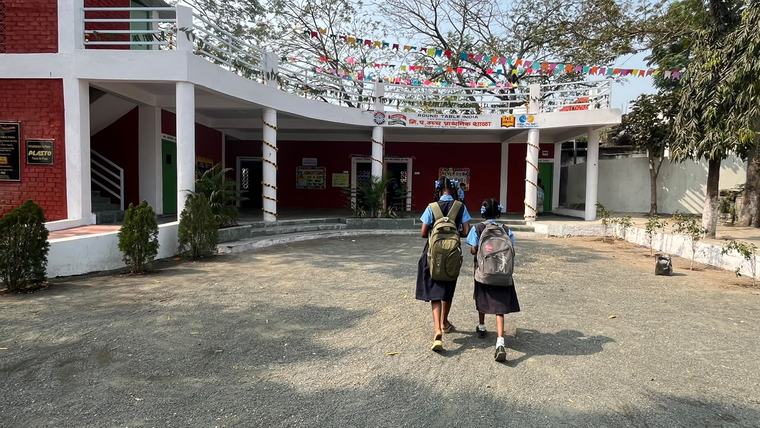 Two girls arriving at the Nagazari school on inauguration day
