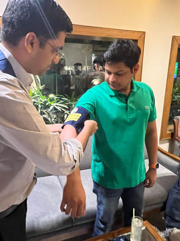 The Sergeant at Arms being given his armband